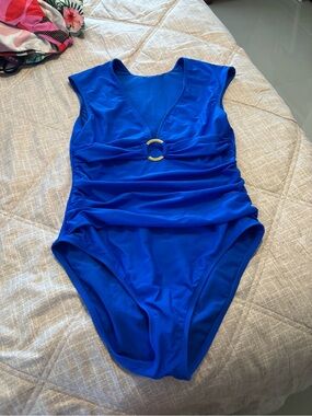 NWOT Royal Blue cut tag designer Swimsuit with extended shoulder cap design